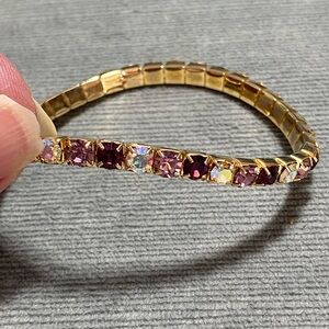 Vintage goldtone stretch bracelet with purple & pink gemstone on square settings